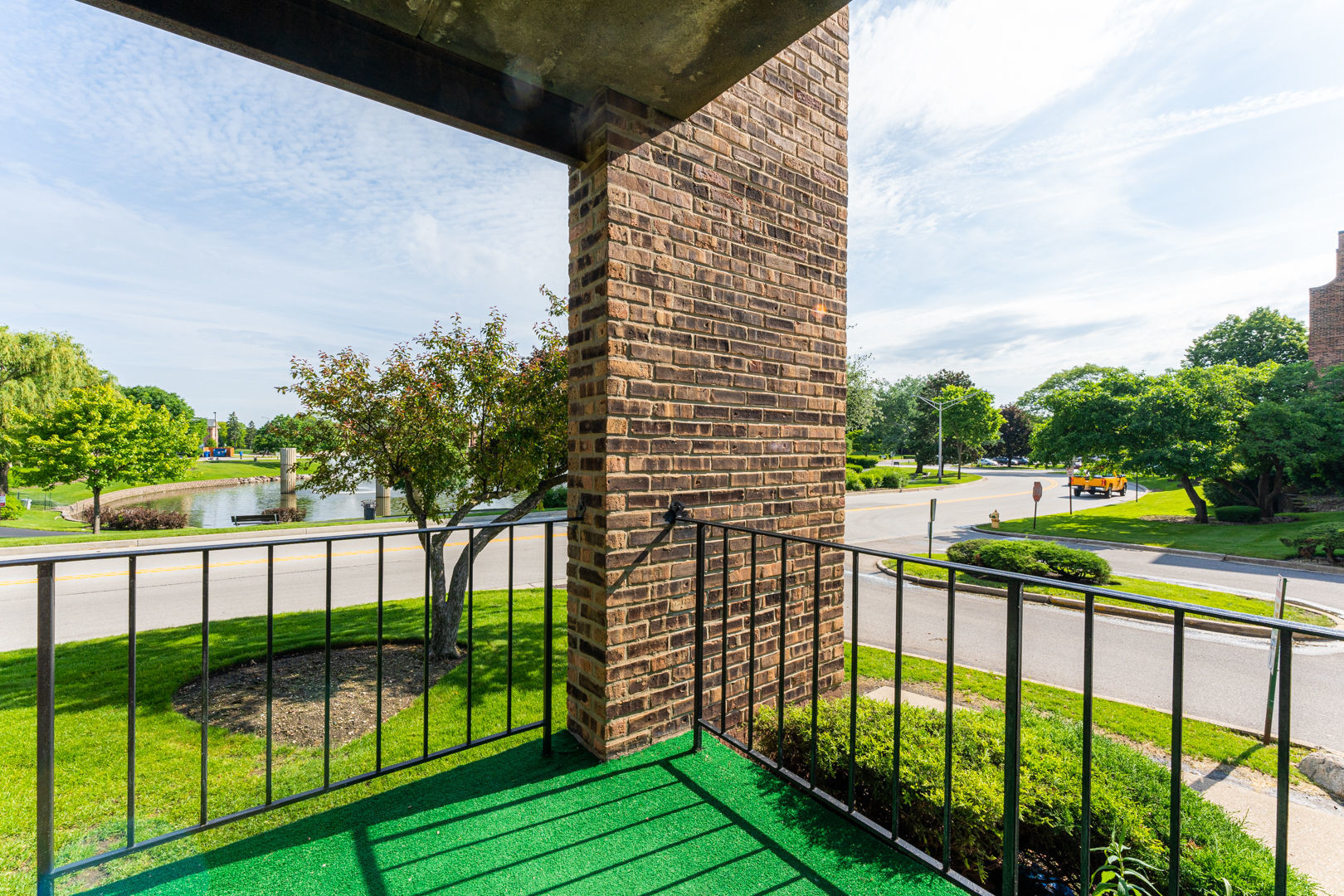 625 West Huntington Commons Road, Unit 106 Mount Prospect, IL 60056 - Photo 6 of 17 a view of building from balcony