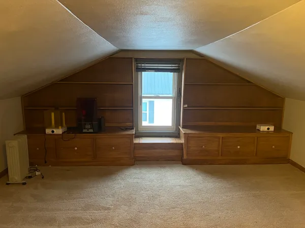 a room with window and furniture