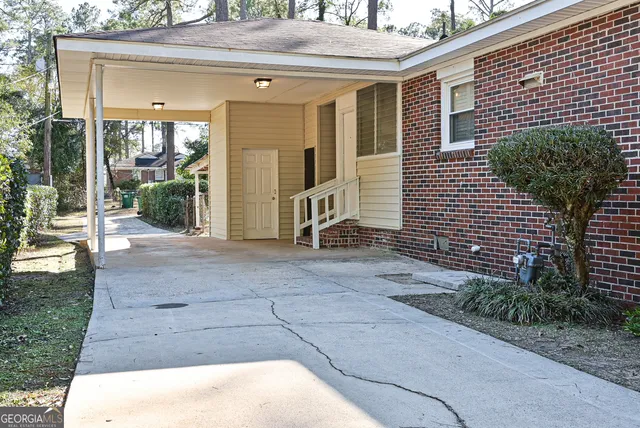 a view of a house with backyard and garage