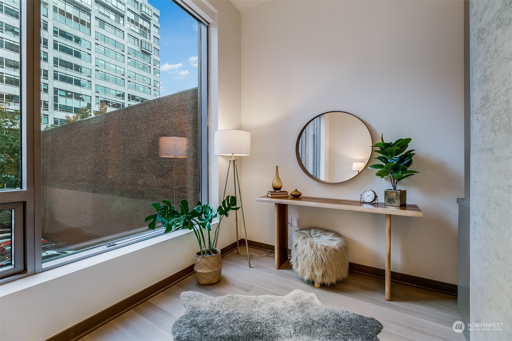 2033 2nd Avenue, Unit 101 Seattle, WA 98121 - Photo 15 of 37 a room with painting on wall and a potted plant