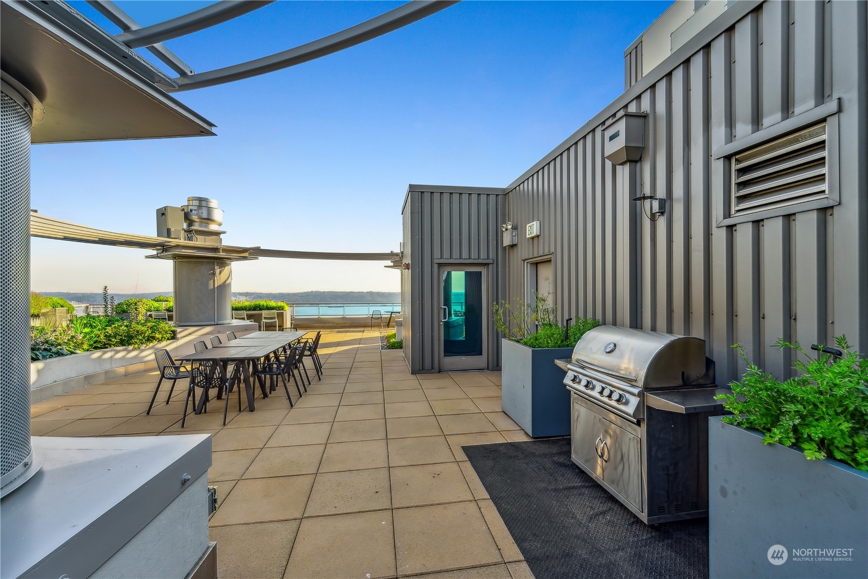 2033 2nd Avenue, Unit 101 Seattle, WA 98121 - Photo 26 of 37 a view of a chairs and table in the patio