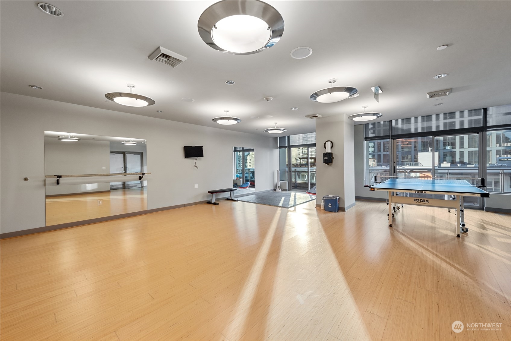 2033 2nd Avenue, Unit 101 Seattle, WA 98121 - Photo 34 of 37 a large swimming pool with a large window and chandelier