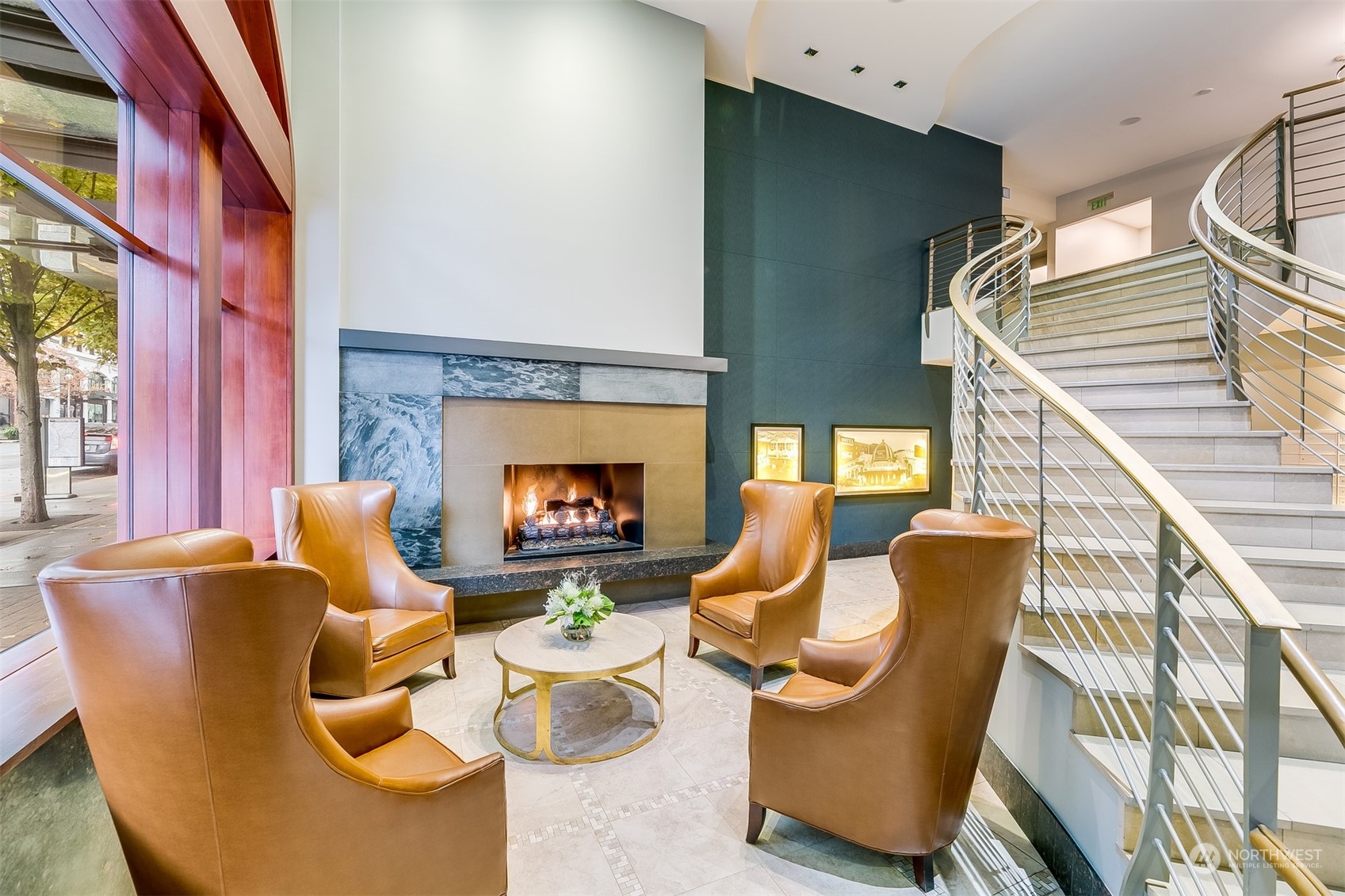 2033 2nd Avenue, Unit 101 Seattle, WA 98121 - Photo 4 of 37 a living room with furniture a fireplace and a large window