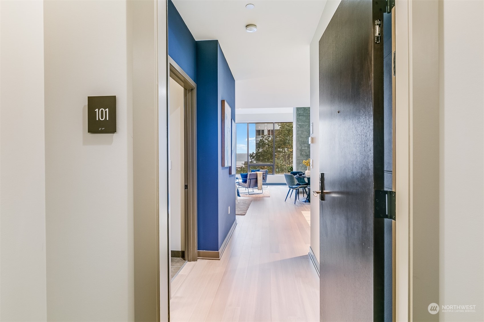 2033 2nd Avenue, Unit 101 Seattle, WA 98121 - Photo 5 of 37 a view of a living room with a large window