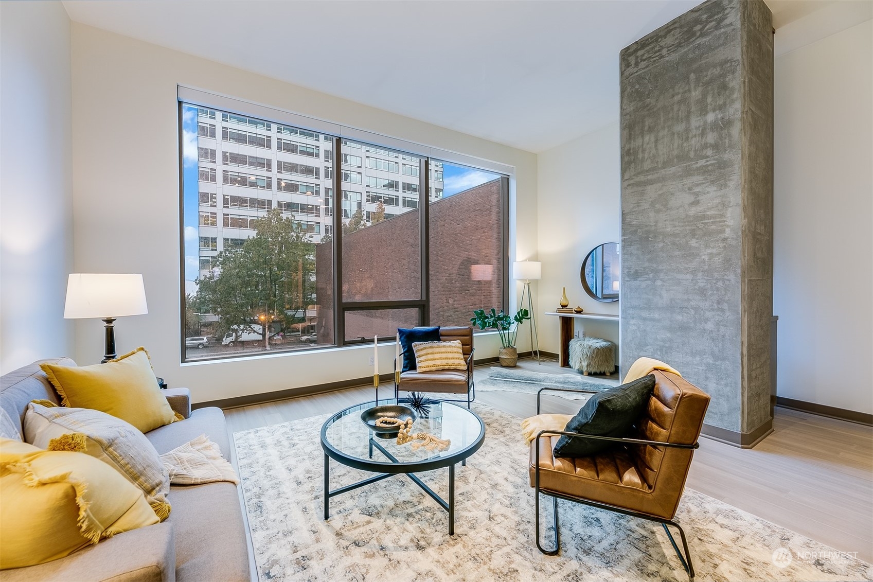 2033 2nd Avenue, Unit 101 Seattle, WA 98121 - Photo 6 of 37 a living room with furniture and a window