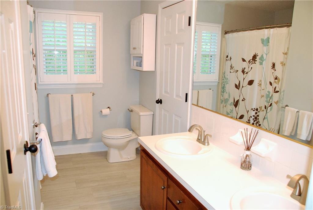 840 Laverton Lane Rural Hall, NC 27045 - Photo 12 of 17 Main level / primary bath with garden tub/shower combo, dual vanity & new tile floor
