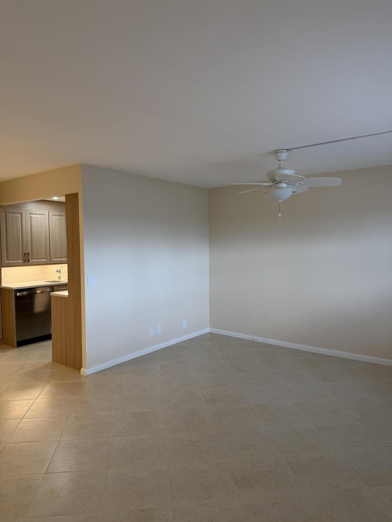 4067 Yarmouth C Boca Raton, FL 33434 - Photo 20 of 39 an empty room with a kitchen