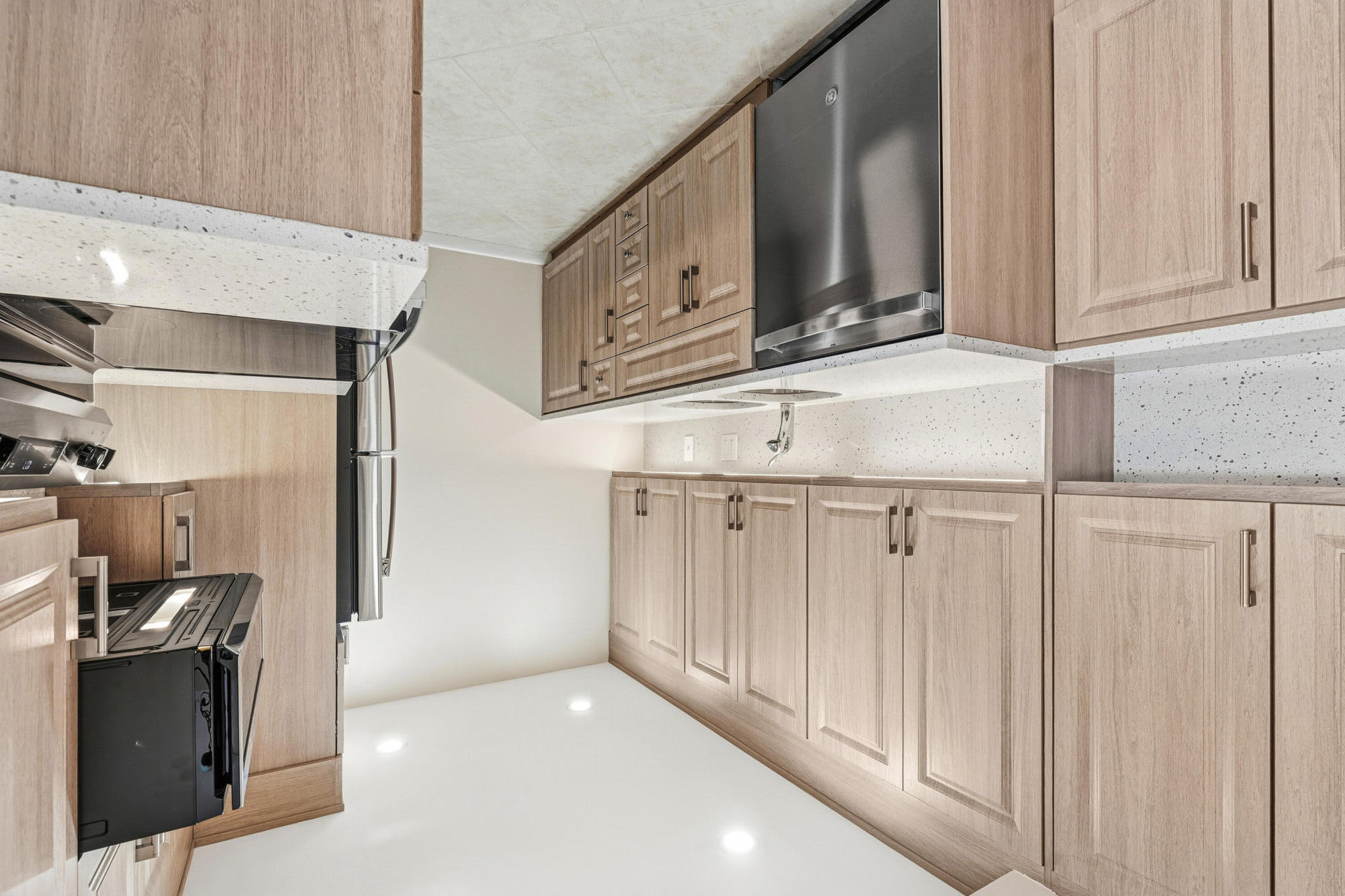 4067 Yarmouth C Boca Raton, FL 33434 - Photo 2 of 39 a view of cabinets and stainless steel appliances