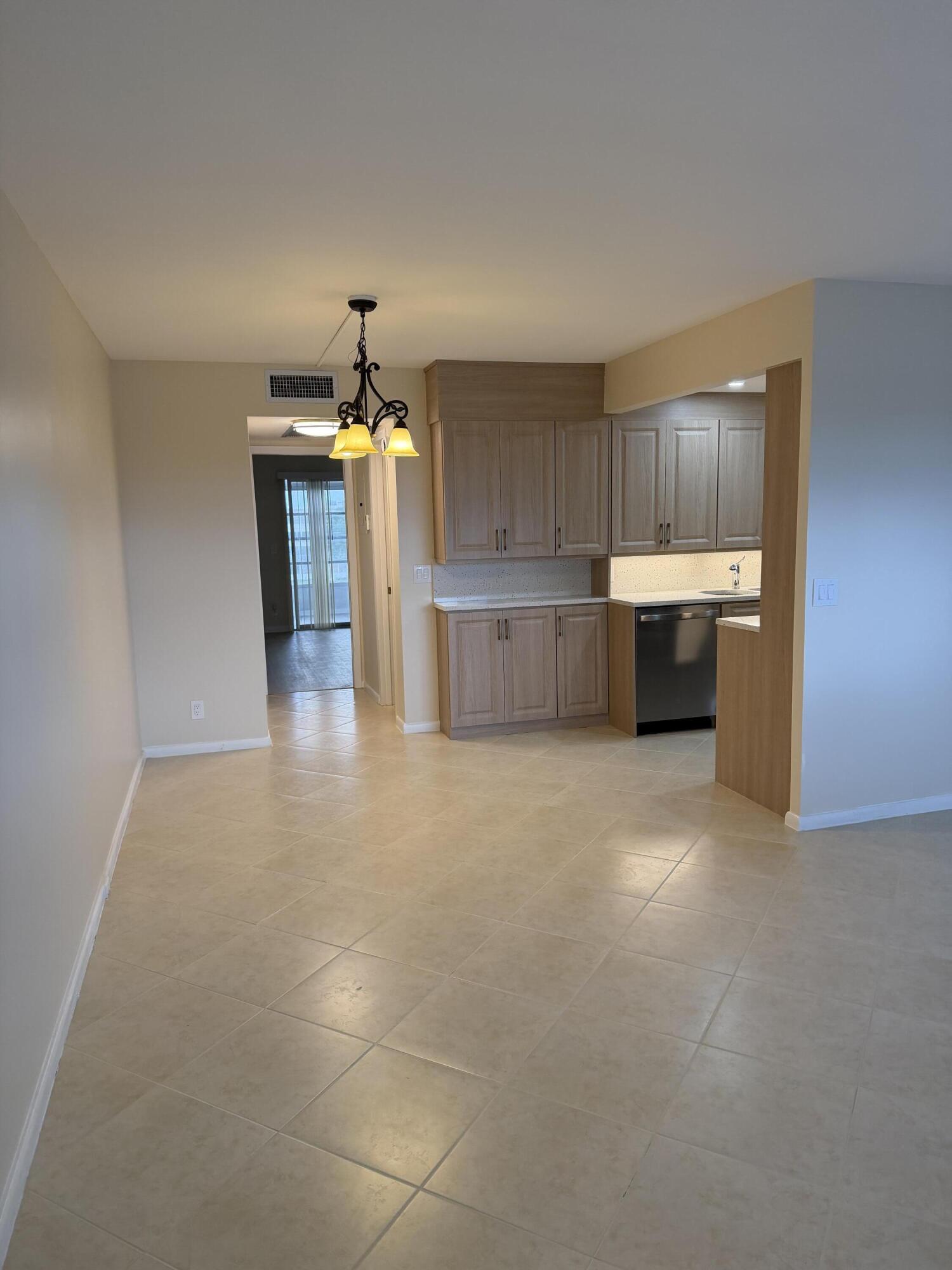 4067 Yarmouth C Boca Raton, FL 33434 - Photo 21 of 39 a view of a kitchen with a sink cabinets and window