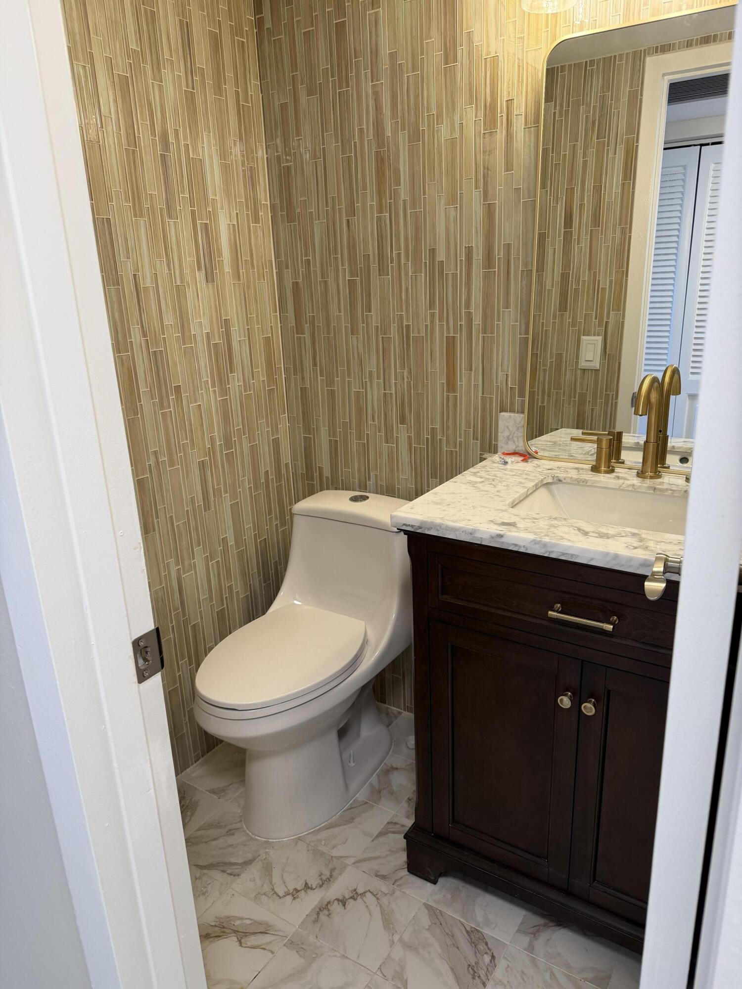 4067 Yarmouth C Boca Raton, FL 33434 - Photo 24 of 39 a bathroom with a sink and a toilet