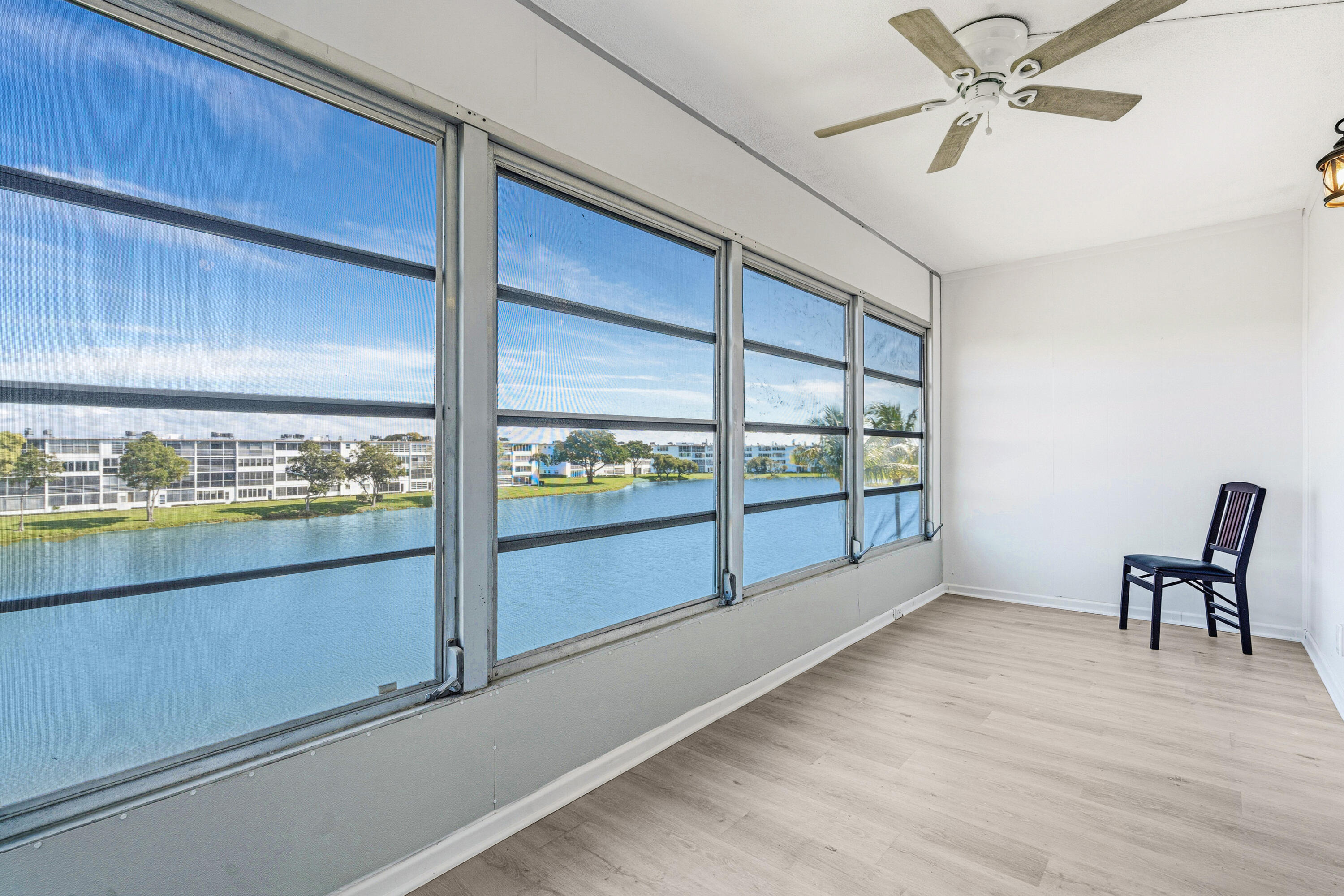 4067 Yarmouth C Boca Raton, FL 33434 - Photo 35 of 39 a view of a room with window and wooden floor