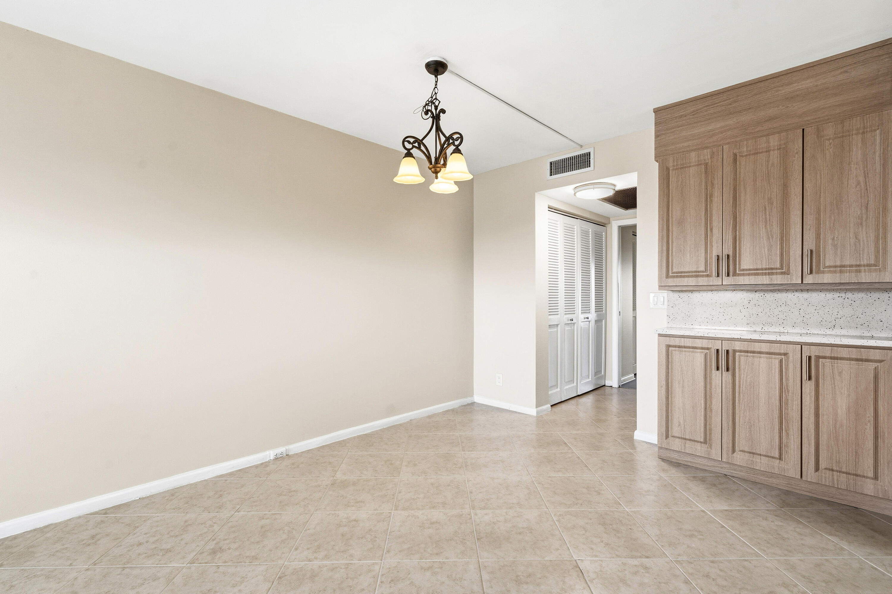 4067 Yarmouth C Boca Raton, FL 33434 - Photo 9 of 39 a view of a chandelier fan and entryway