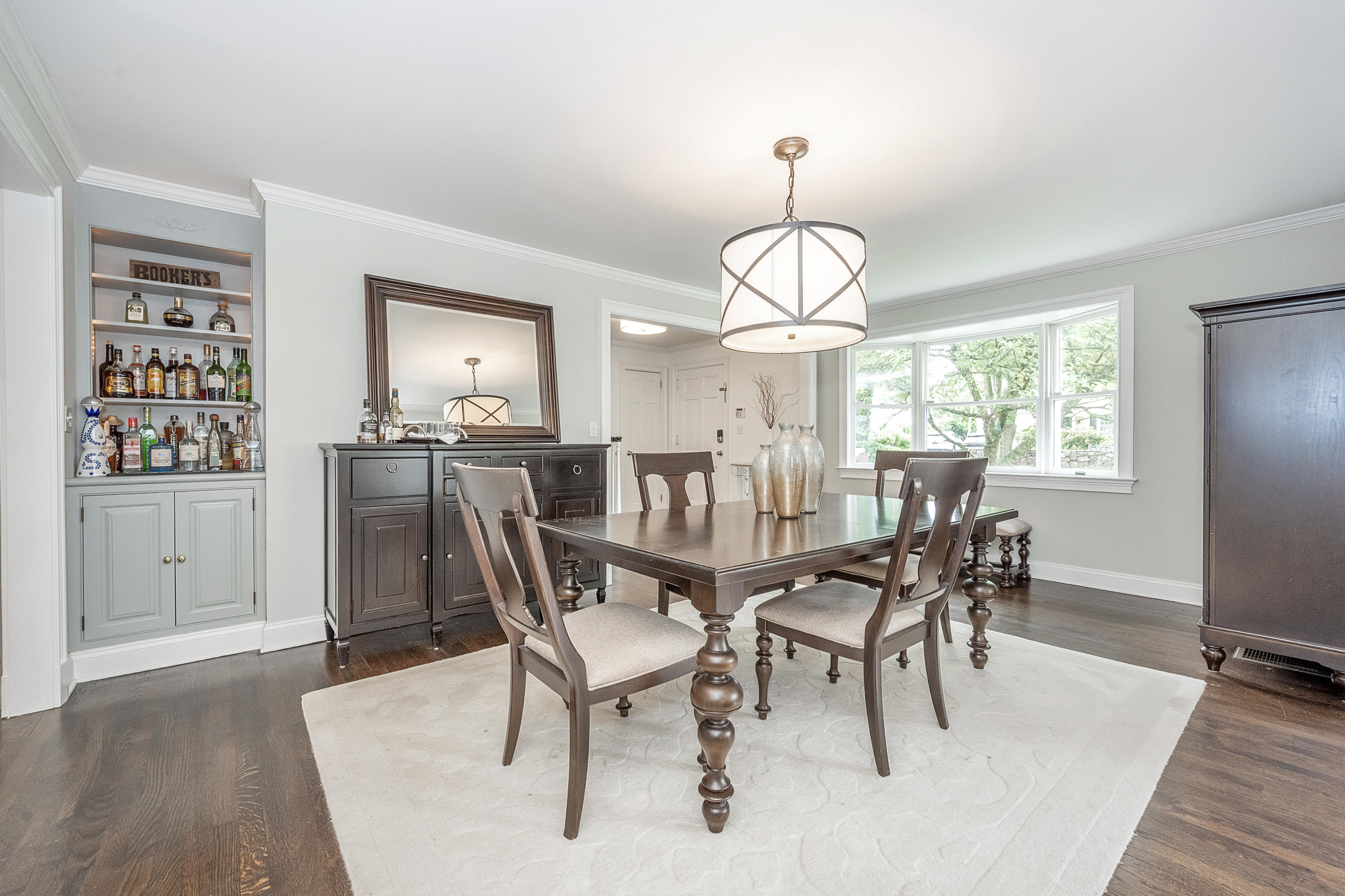107 Hollow Tree Ridge Road Darien, CT 06820 - Photo 12 of 32 a view of a dining room with furniture window and wooden floor