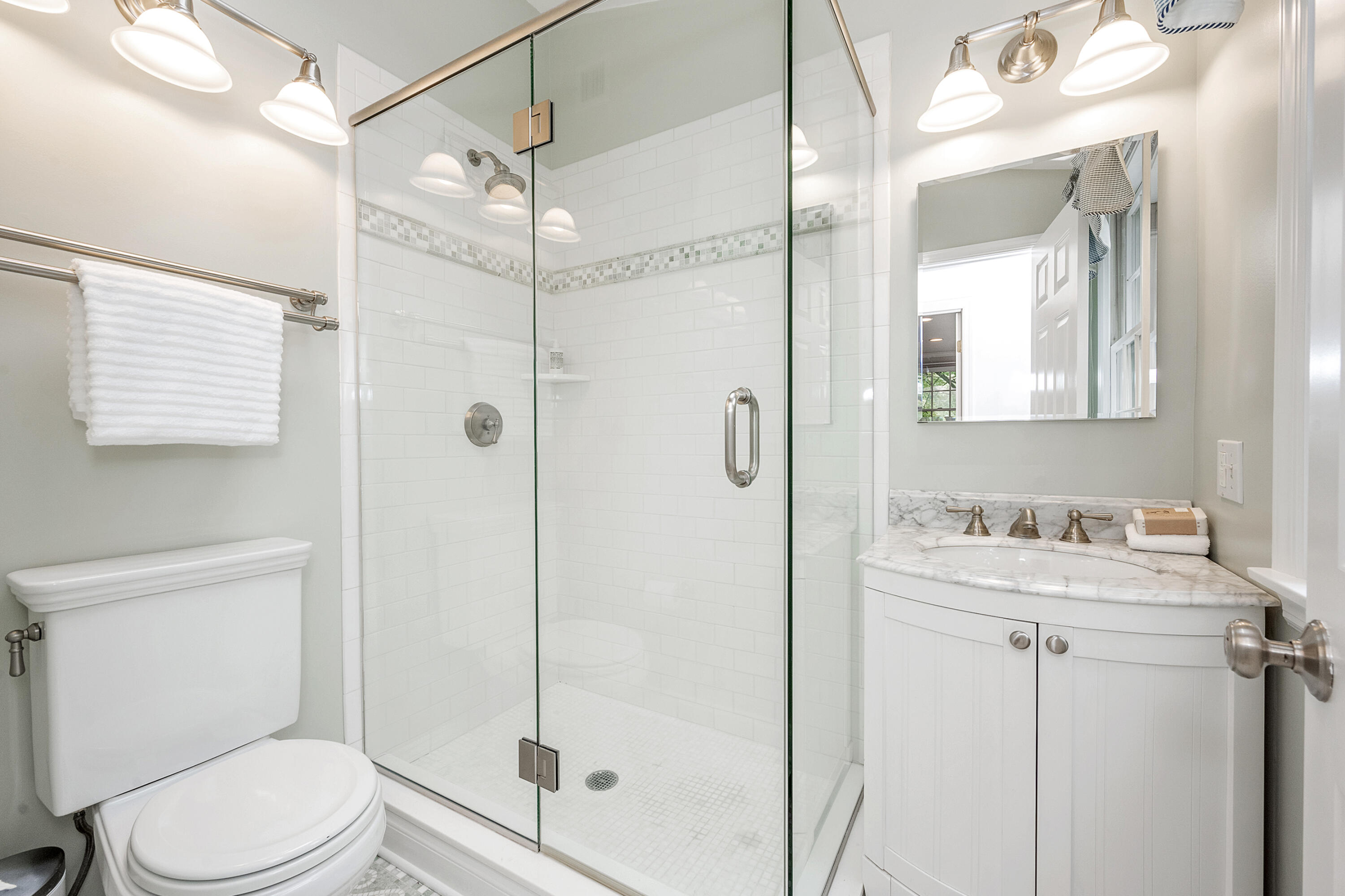 107 Hollow Tree Ridge Road Darien, CT 06820 - Photo 14 of 32 a bathroom with a toilet sink vanity and shower