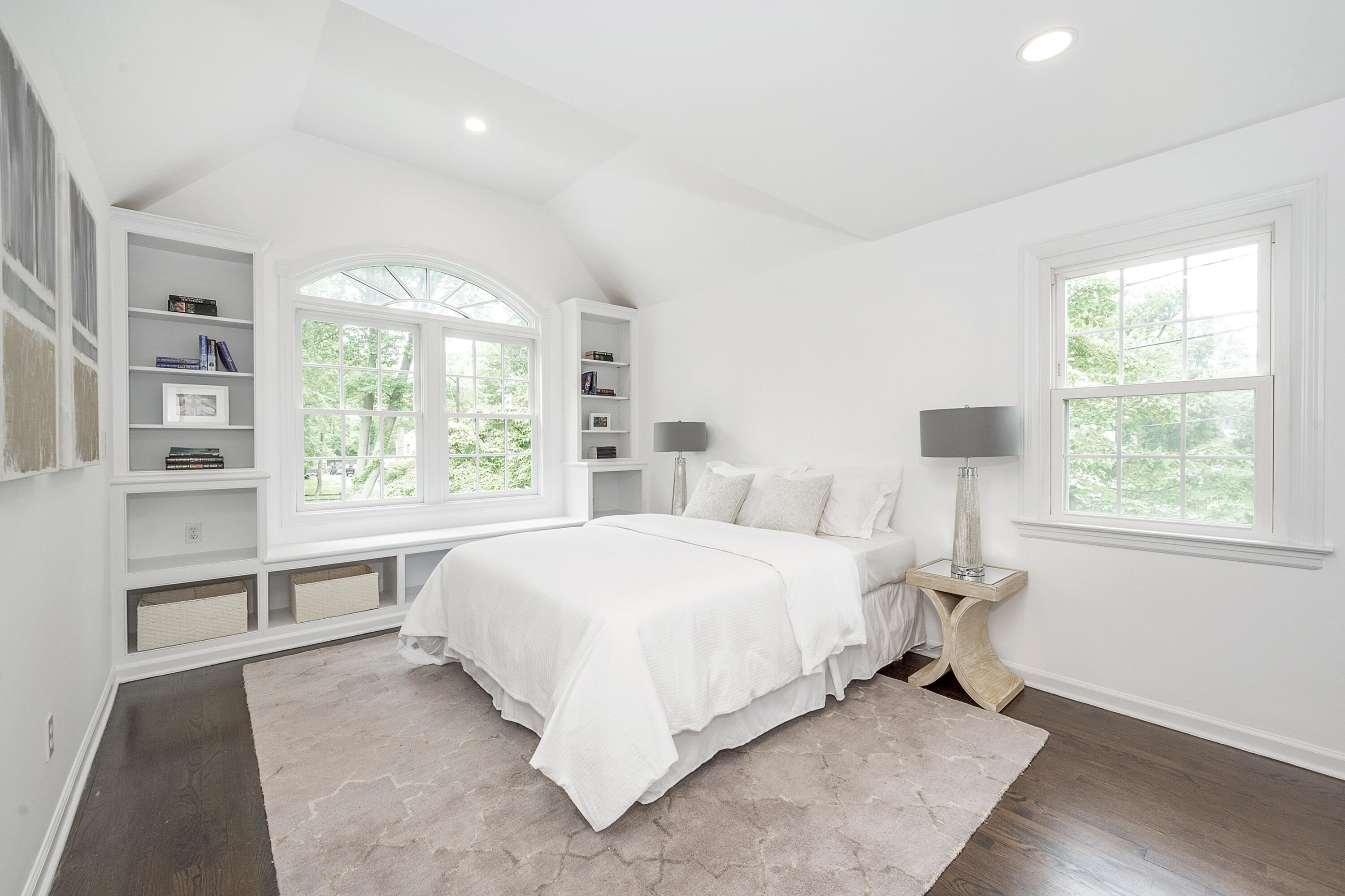 107 Hollow Tree Ridge Road Darien, CT 06820 - Photo 16 of 32 a bedroom with a bed and a large window
