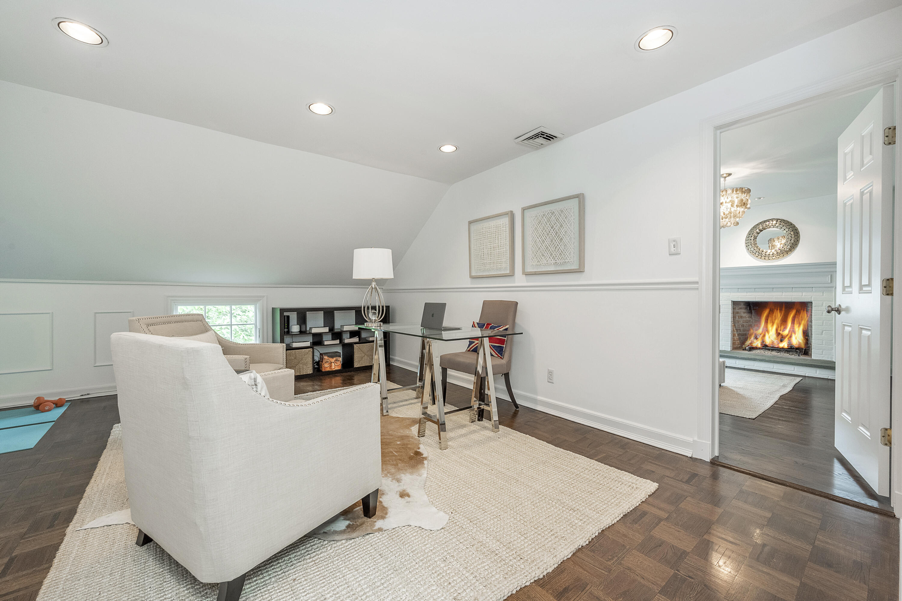 107 Hollow Tree Ridge Road Darien, CT 06820 - Photo 20 of 32 a living room with furniture and a table