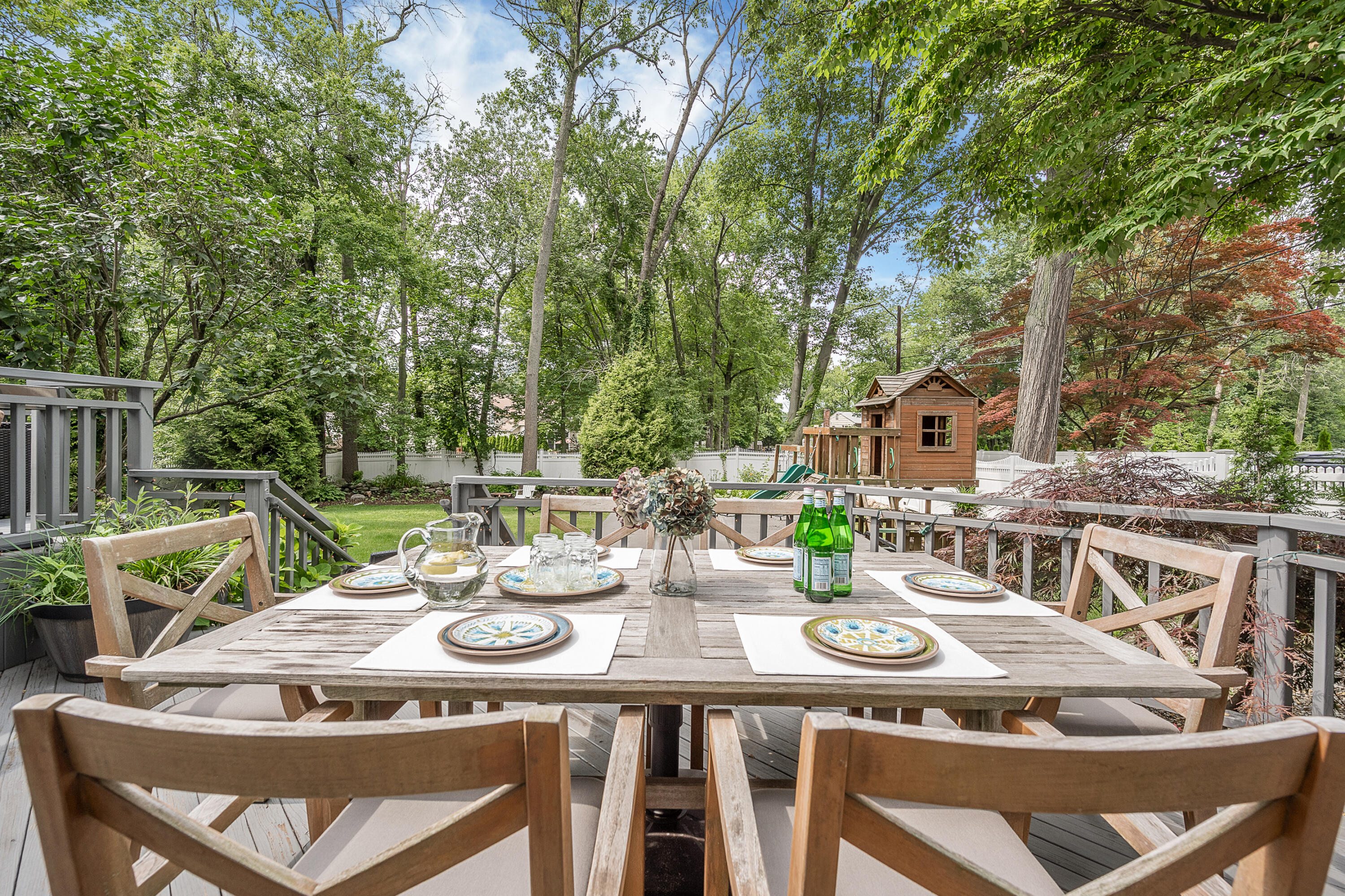 107 Hollow Tree Ridge Road Darien, CT 06820 - Photo 25 of 32 a view of a dinning table and chairs in the patio