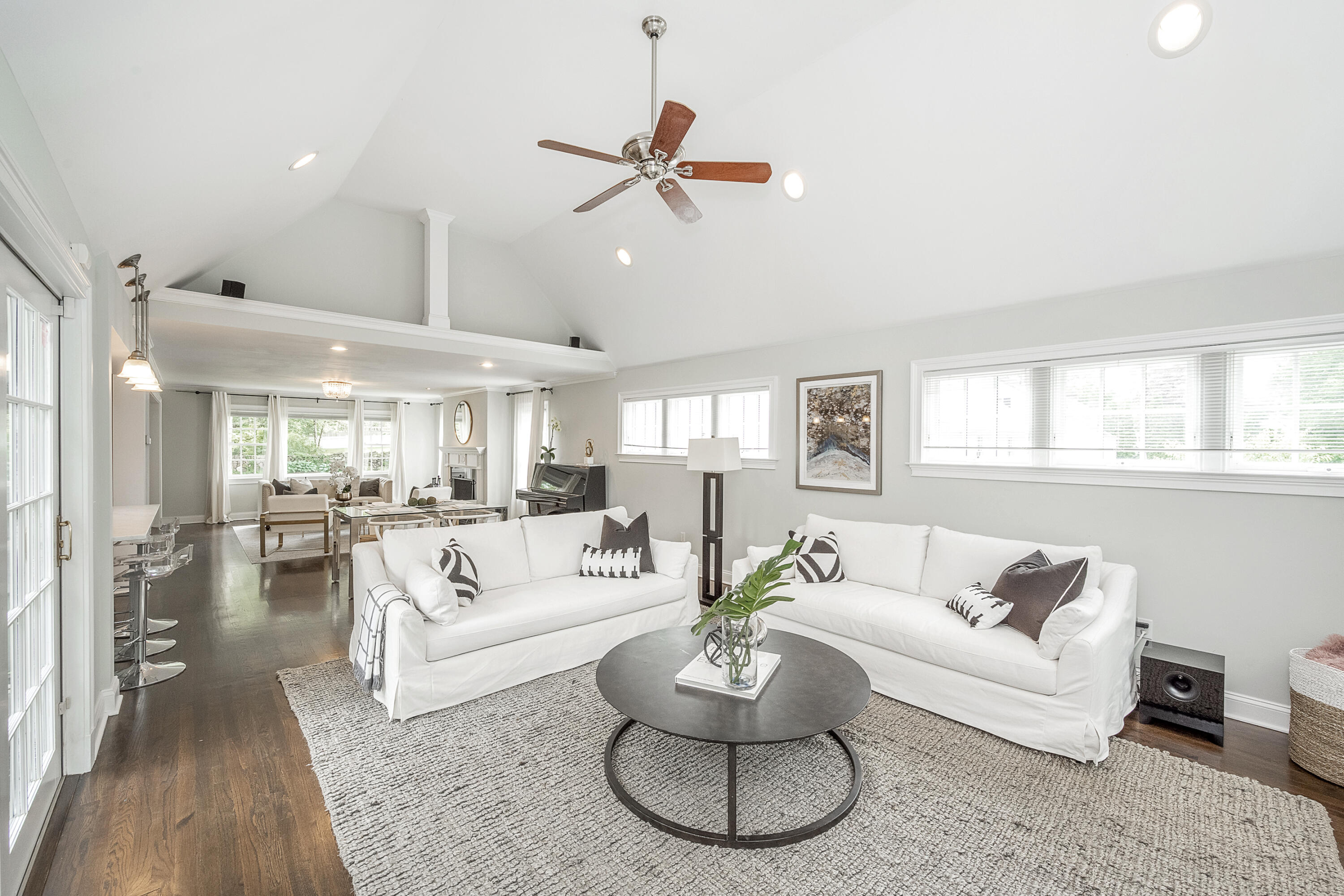 107 Hollow Tree Ridge Road Darien, CT 06820 - Photo 7 of 32 a living room with furniture and a large window