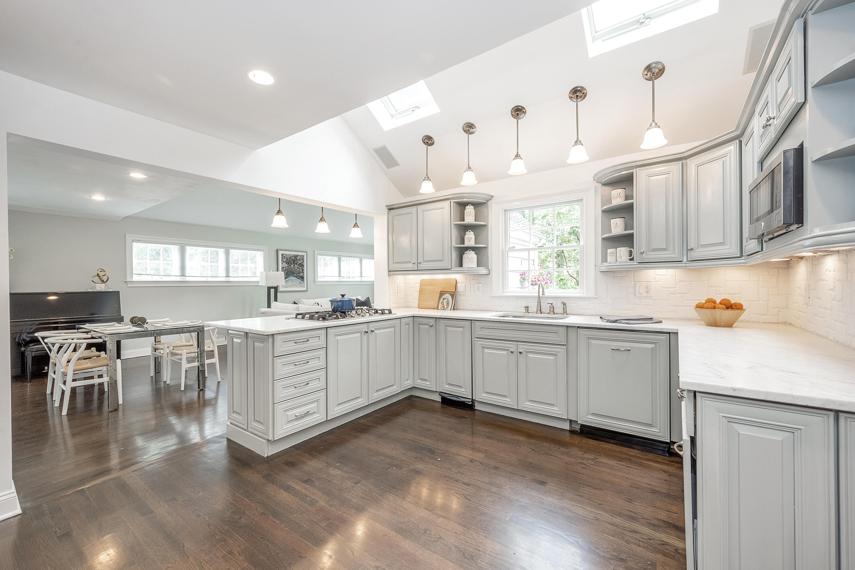107 Hollow Tree Ridge Road Darien, CT 06820 - Photo 10 of 32 a kitchen with white cabinets and white appliances