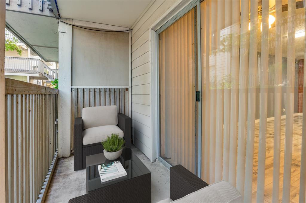 4859 Cedar Springs Road, Unit 144 Dallas, TX 75219 - Photo 13 of 14 a porch with furniture and a potted plant