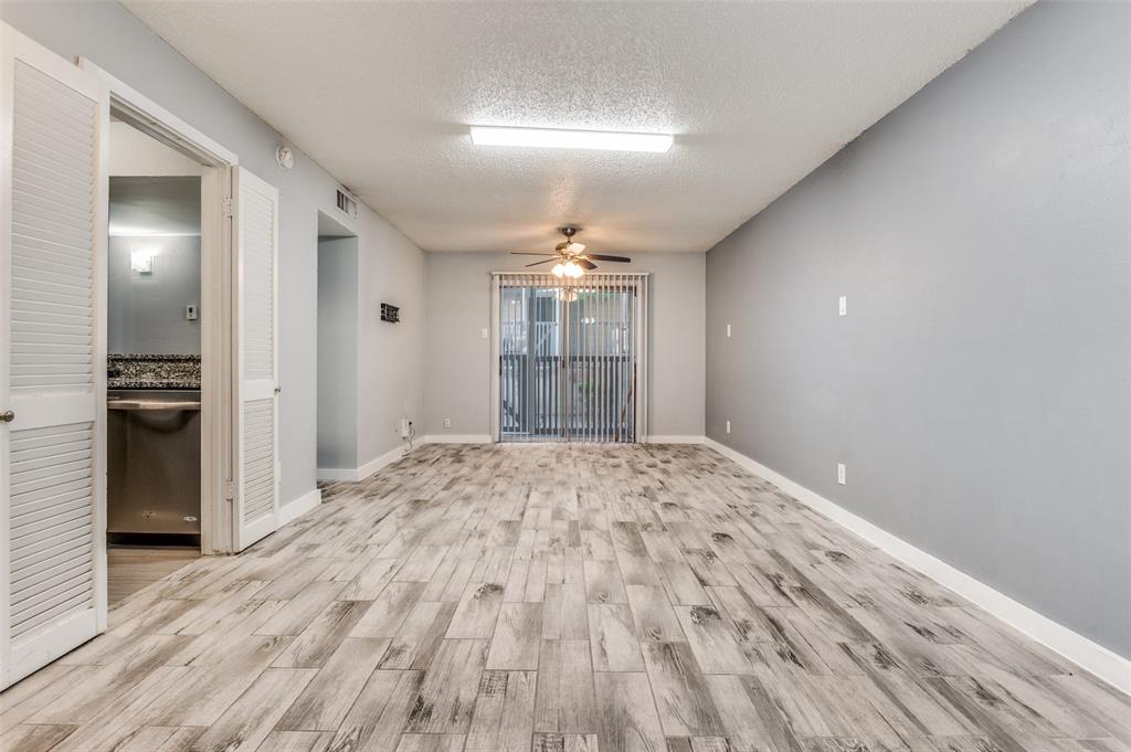 4859 Cedar Springs Road, Unit 144 Dallas, TX 75219 - Photo 5 of 14 a view of empty room with wooden floor