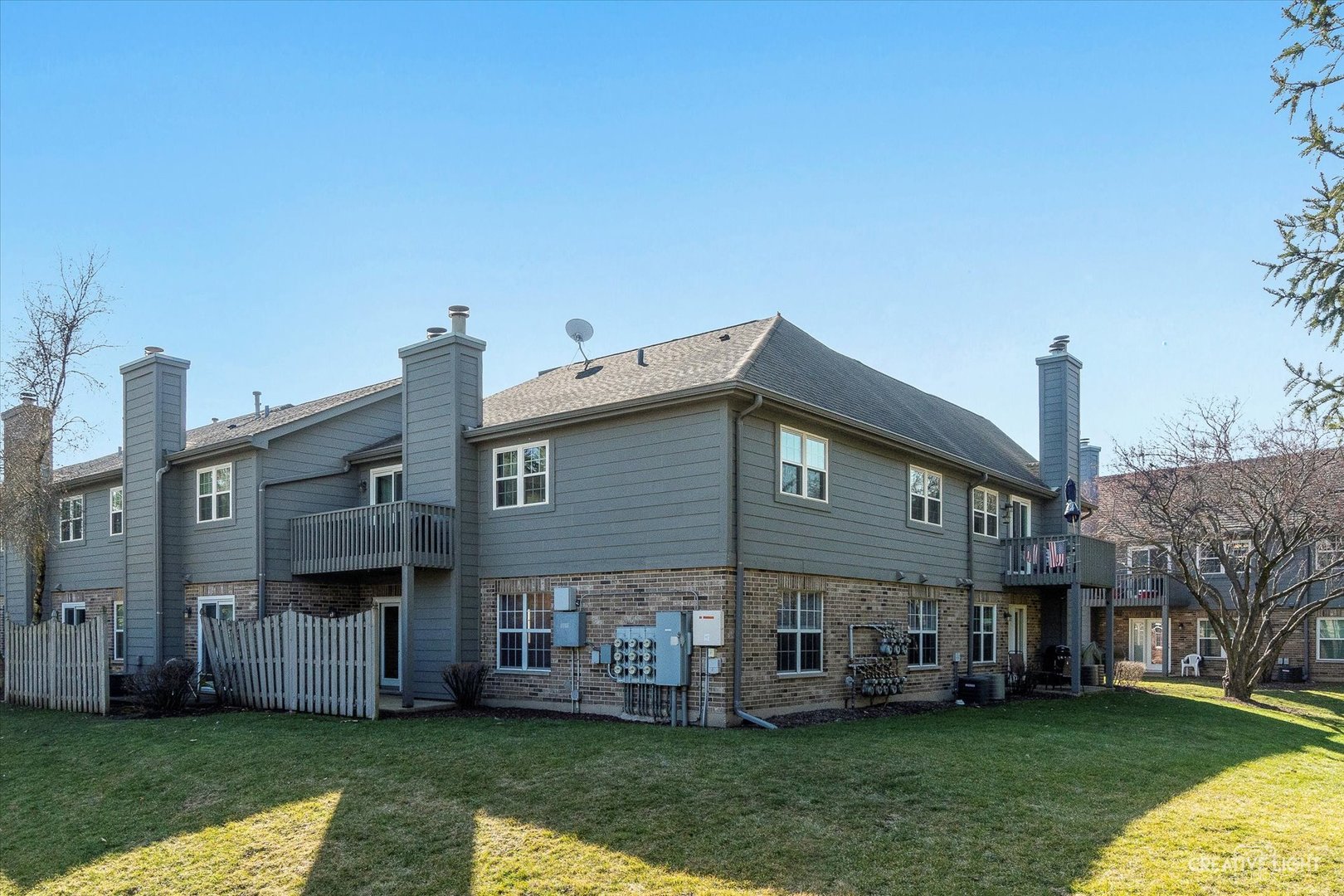 15 Foxcroft Road, Unit 135 Naperville, IL 60565 - Photo 16 of 18 a view of a house with a yard deck and a garden