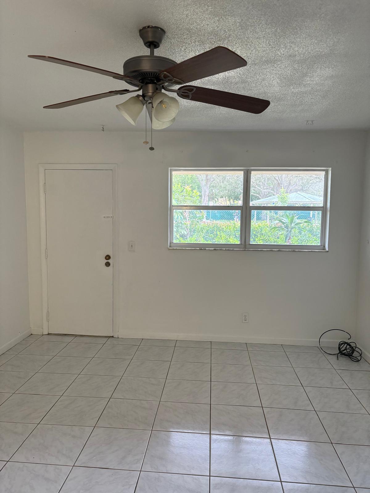 2801 Albatross Road Delray Beach, FL 33444 - Photo 7 of 14 a view of an empty room with a window
