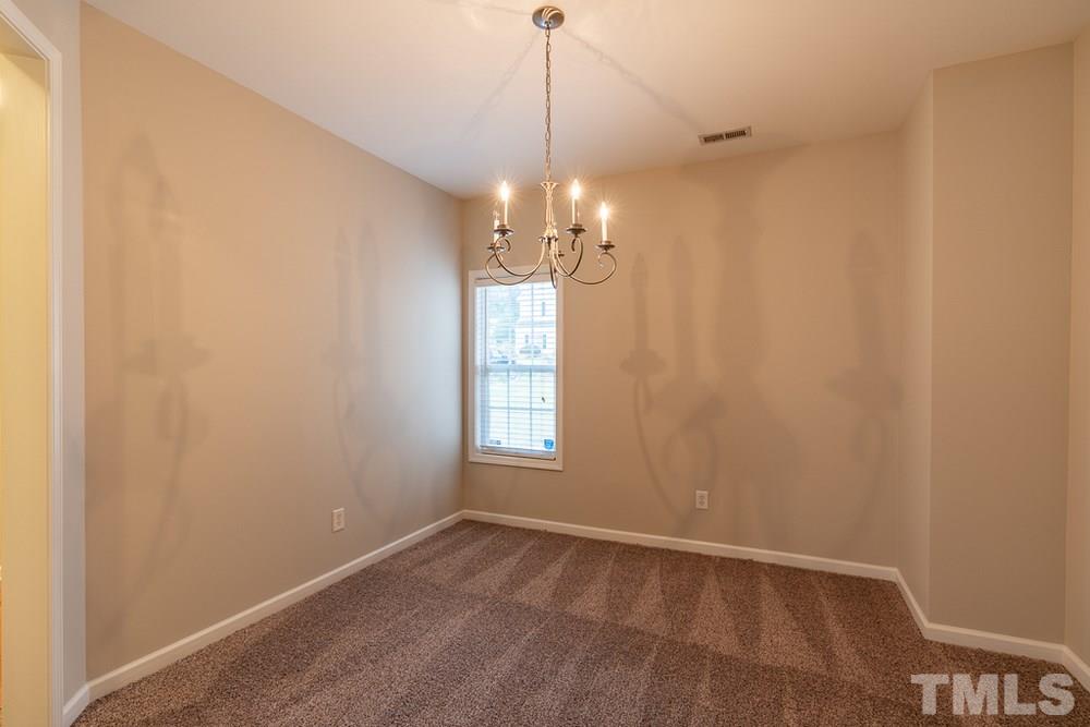 3513 Rendition Street Raleigh, NC 27610 - Photo 2 of 30 a view of a chandelier in big room and chandelier fan