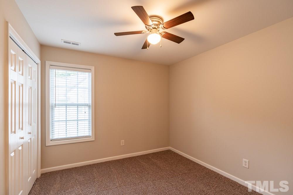 3513 Rendition Street Raleigh, NC 27610 - Photo 17 of 30 an empty room with a window and a fan