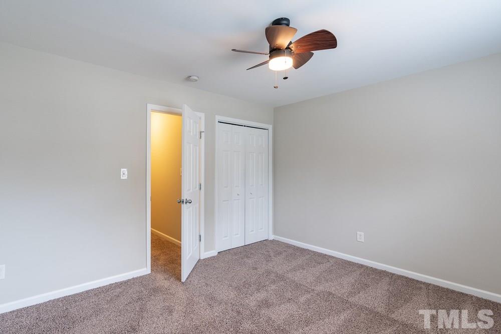 3513 Rendition Street Raleigh, NC 27610 - Photo 24 of 30 an empty room with windows and flowerpot