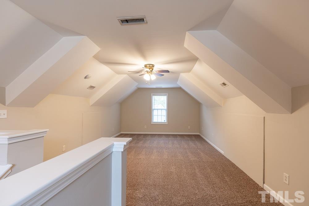 3513 Rendition Street Raleigh, NC 27610 - Photo 26 of 30 a view of a hallway with entryway and chandelier