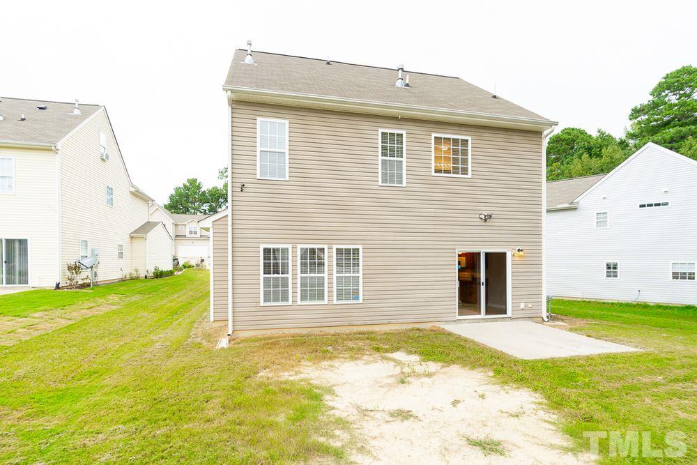 3513 Rendition Street Raleigh, NC 27610 - Photo 29 of 30 a view of a house with a yard