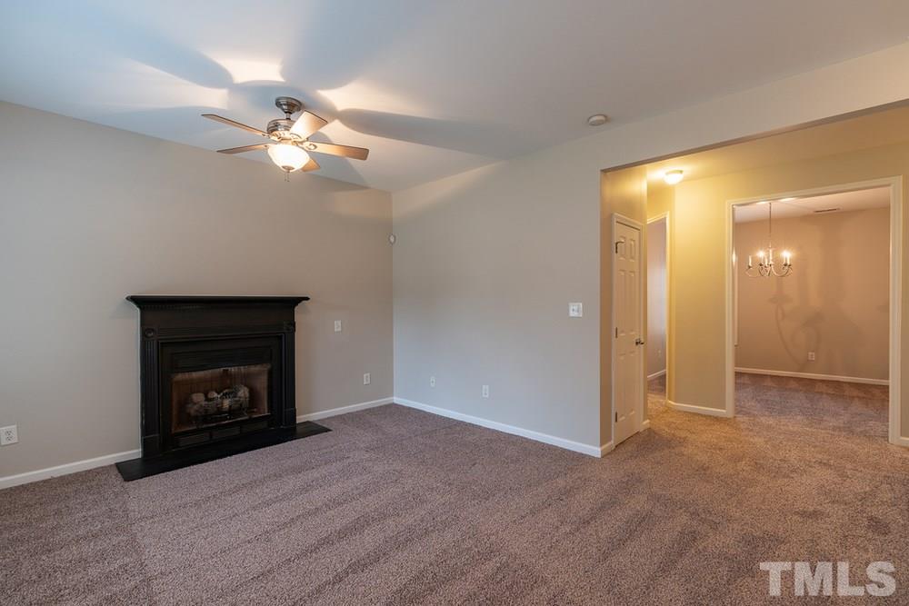 3513 Rendition Street Raleigh, NC 27610 - Photo 4 of 30 a view of an empty room with a fireplace