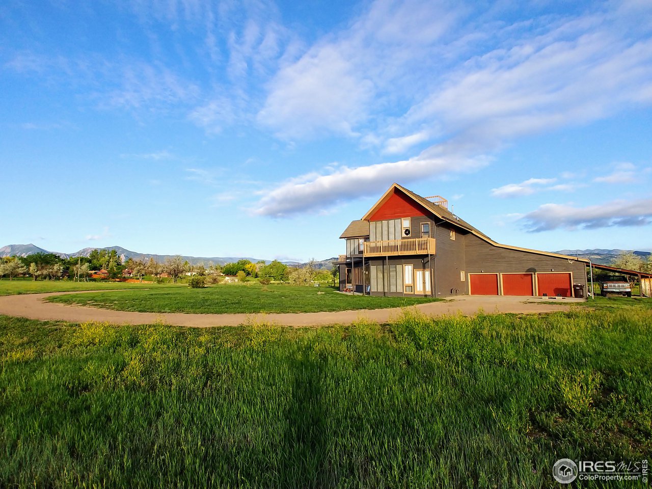 5775 Jay Road Boulder, CO 80301 - Photo 2 of 37 a view of big house with a big yard and large trees
