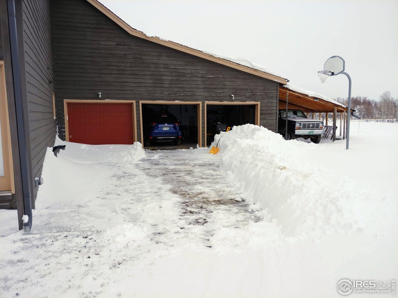 5775 Jay Road Boulder, CO 80301 - Photo 22 of 37 a front view of a house with a yard covered in snow