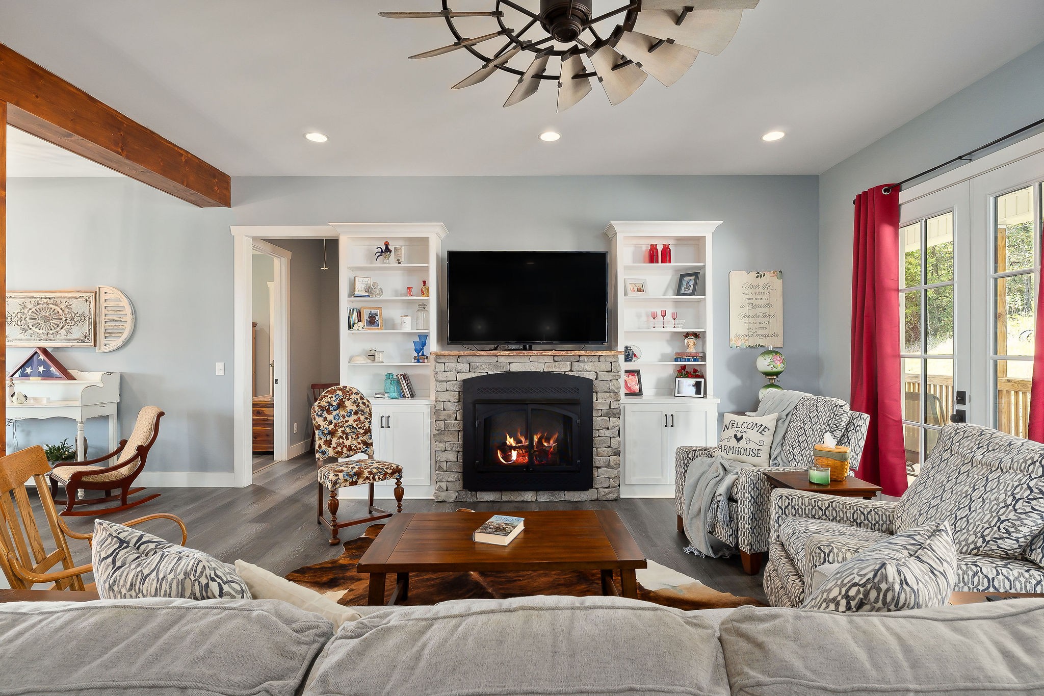 881 Eagle Mountain Road Granville, TN 38564 - Photo 15 of 49 a living room with furniture a flat screen tv and a fireplace