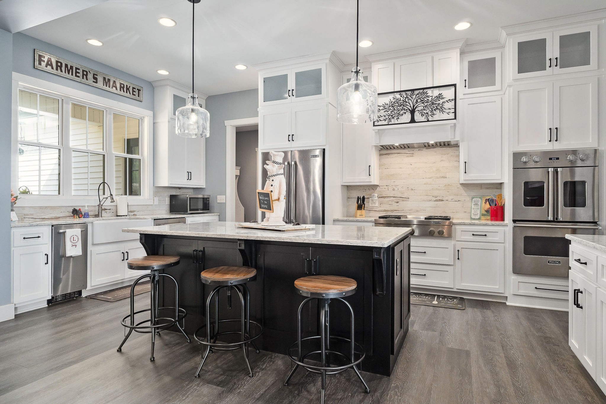 881 Eagle Mountain Road Granville, TN 38564 - Photo 16 of 49 a kitchen with stainless steel appliances granite countertop a table chairs stove and kitchen island