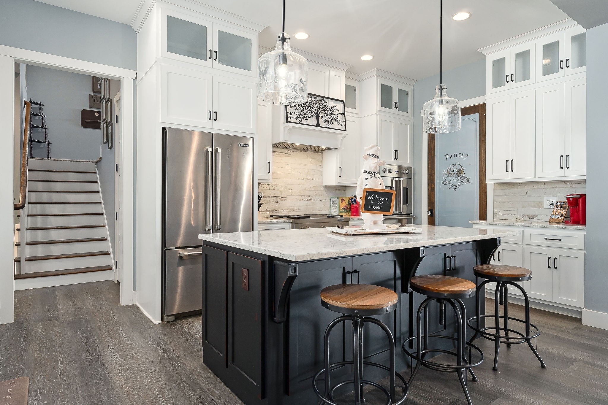 881 Eagle Mountain Road Granville, TN 38564 - Photo 17 of 49 a kitchen with stainless steel appliances kitchen island granite countertop a table chairs sink and cabinets