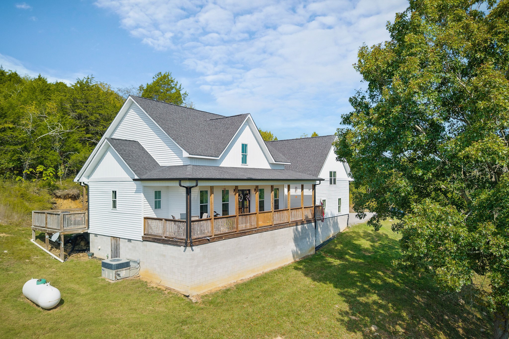 881 Eagle Mountain Road Granville, TN 38564 - Photo 2 of 49 an aerial view of a house with swimming pool next to a yard