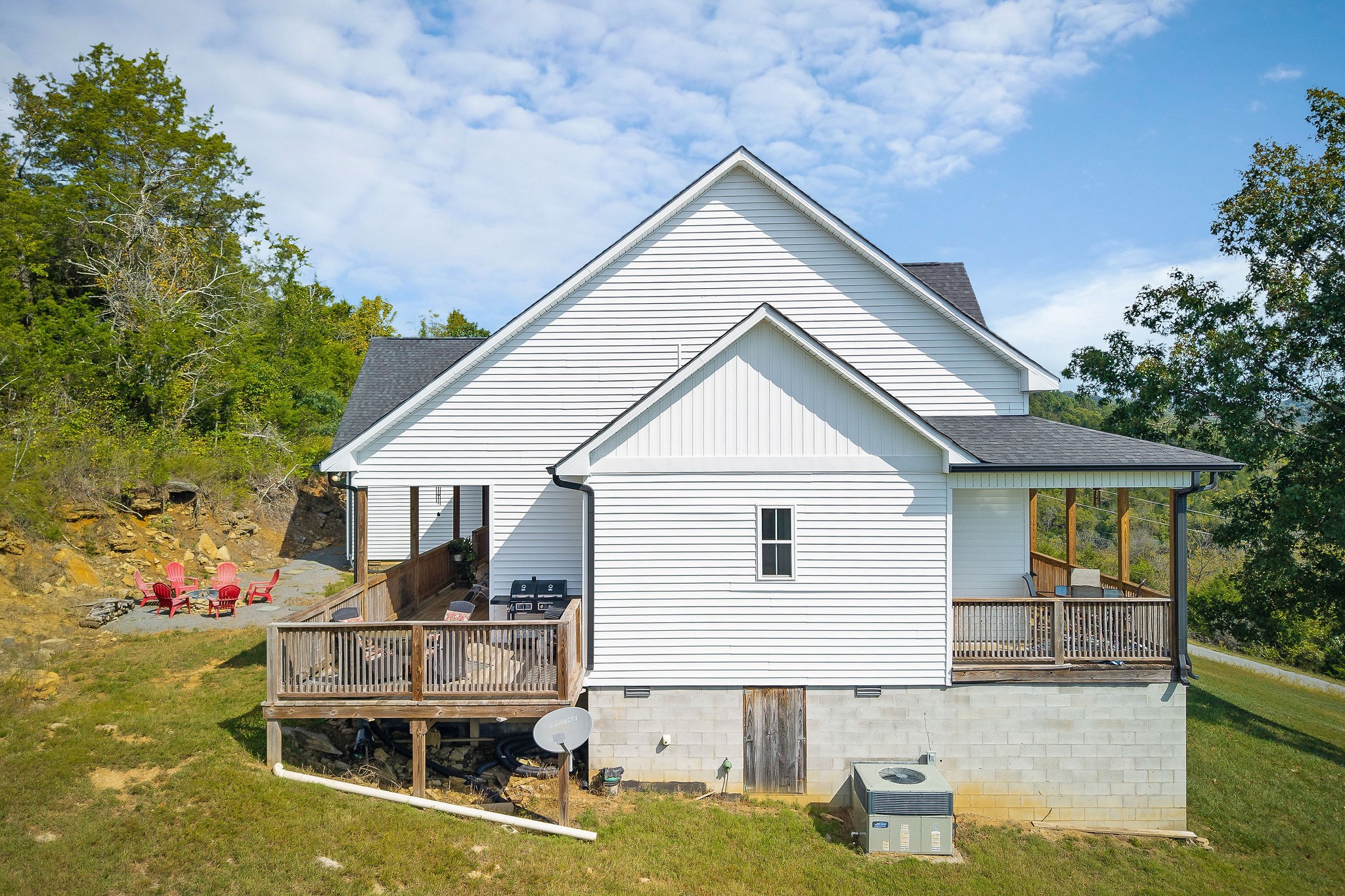 881 Eagle Mountain Road Granville, TN 38564 - Photo 3 of 49 a front view of house with yard outdoor seating and barbeque oven