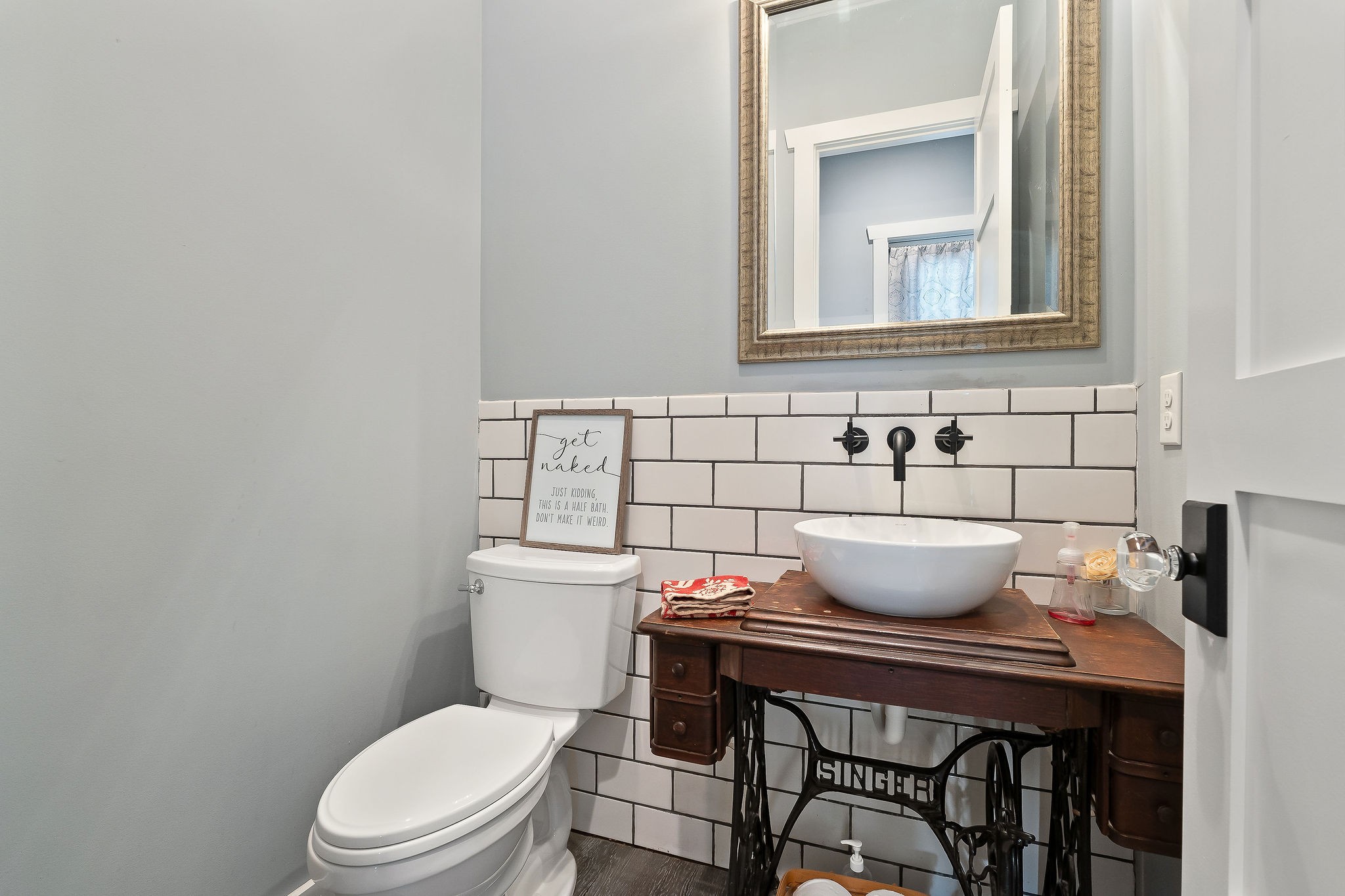 881 Eagle Mountain Road Granville, TN 38564 - Photo 33 of 49 a bathroom with a toilet a sink and a mirror