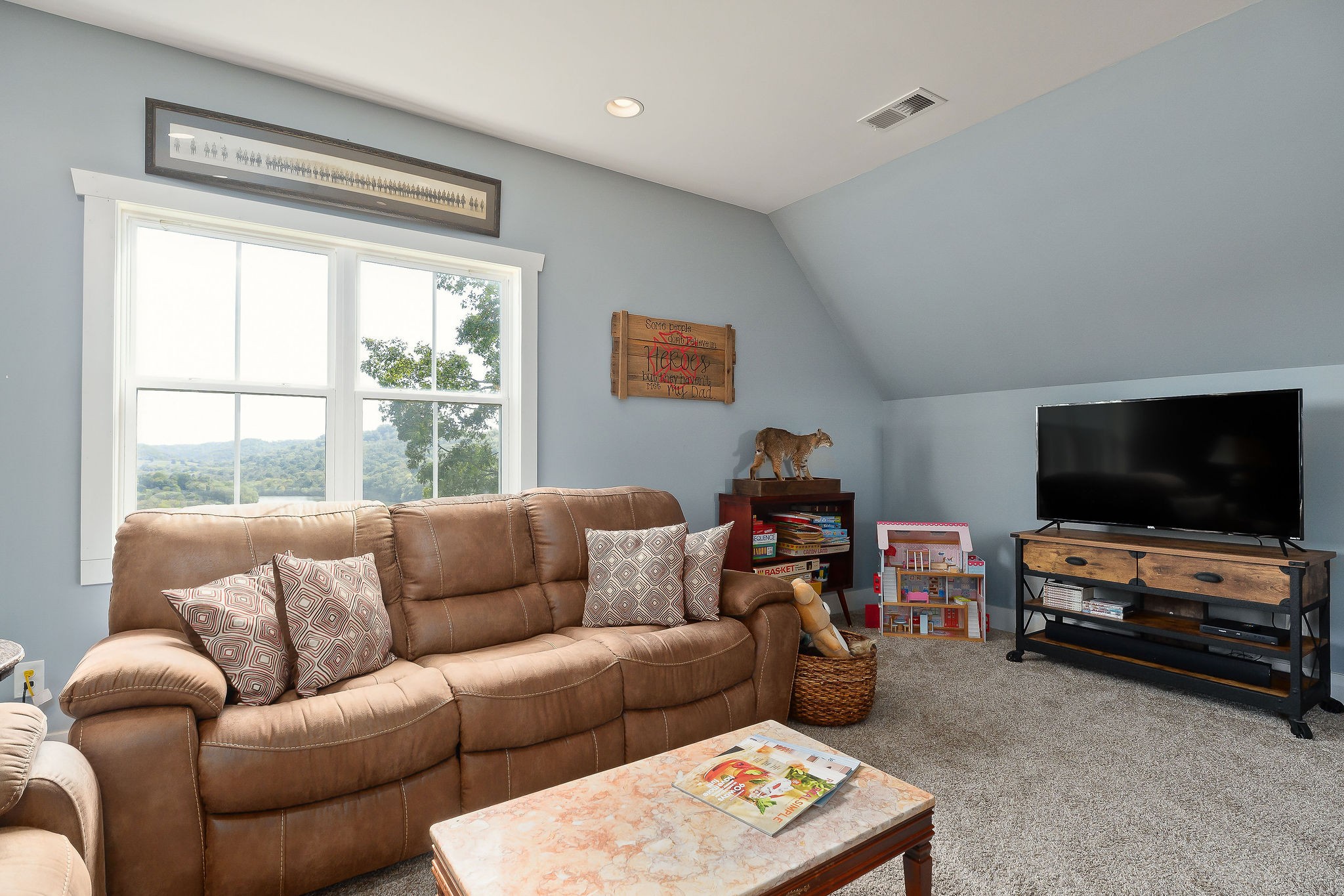 881 Eagle Mountain Road Granville, TN 38564 - Photo 38 of 49 a living room with furniture and a flat screen tv