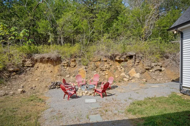 a view of a balcony with wooden floor and outdoor seating