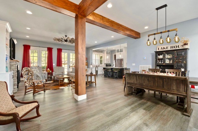 881 Eagle Mountain Road Granville, TN 38564 - Photo 46 of 49 a living room with furniture kitchen view and a wooden floor