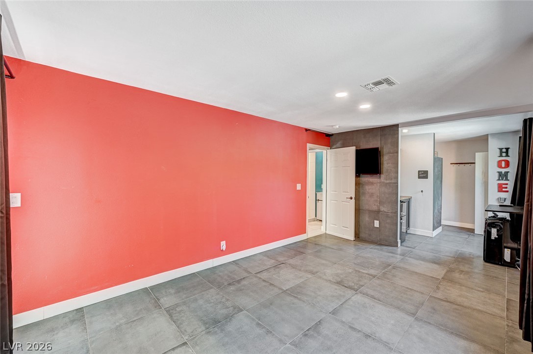 4153 Woodcrest Road Las Vegas, NV 89121 - Photo 39 of 58 Bright tile flooring creates an airy feel in this spacious, adaptable interior space.