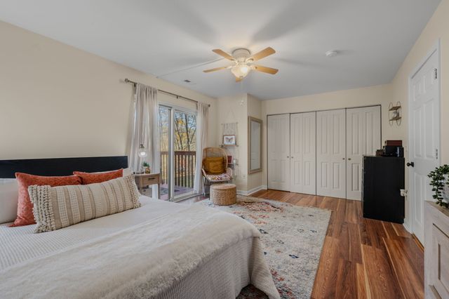 a bedroom with a bed and dresser