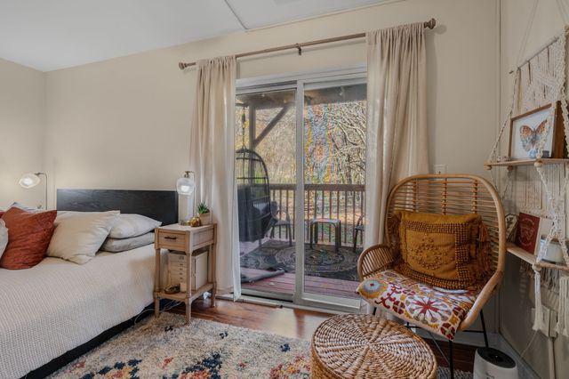 a bedroom with furniture and a window
