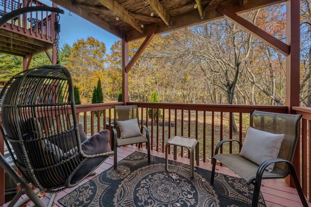 a view of a chairs and table in patio