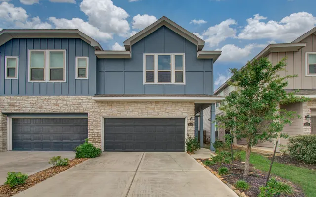 a front view of a house with yard
