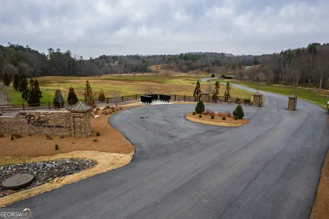 an aerial view of a yard with horses